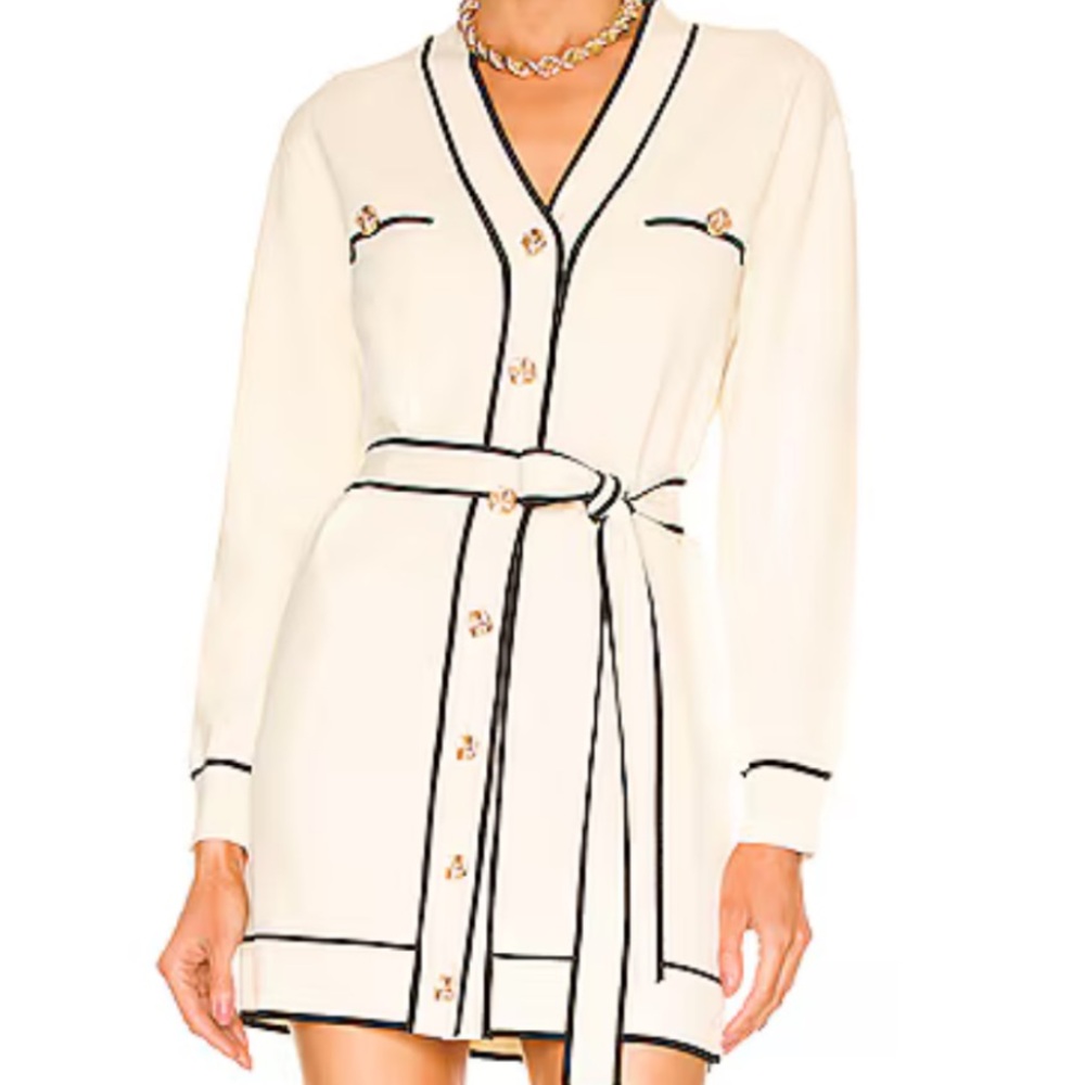 Knit dress in cream with black piping
